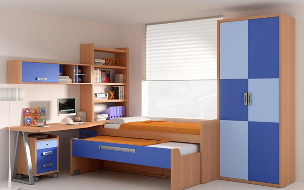 Dormitorio juvenil con cama nido elevada, somier extraíble y cajones inferiores. Incluye escritorio con librería y módulo de almacenamiento. Acabados en chapa sintética, fáciles de limpiar.