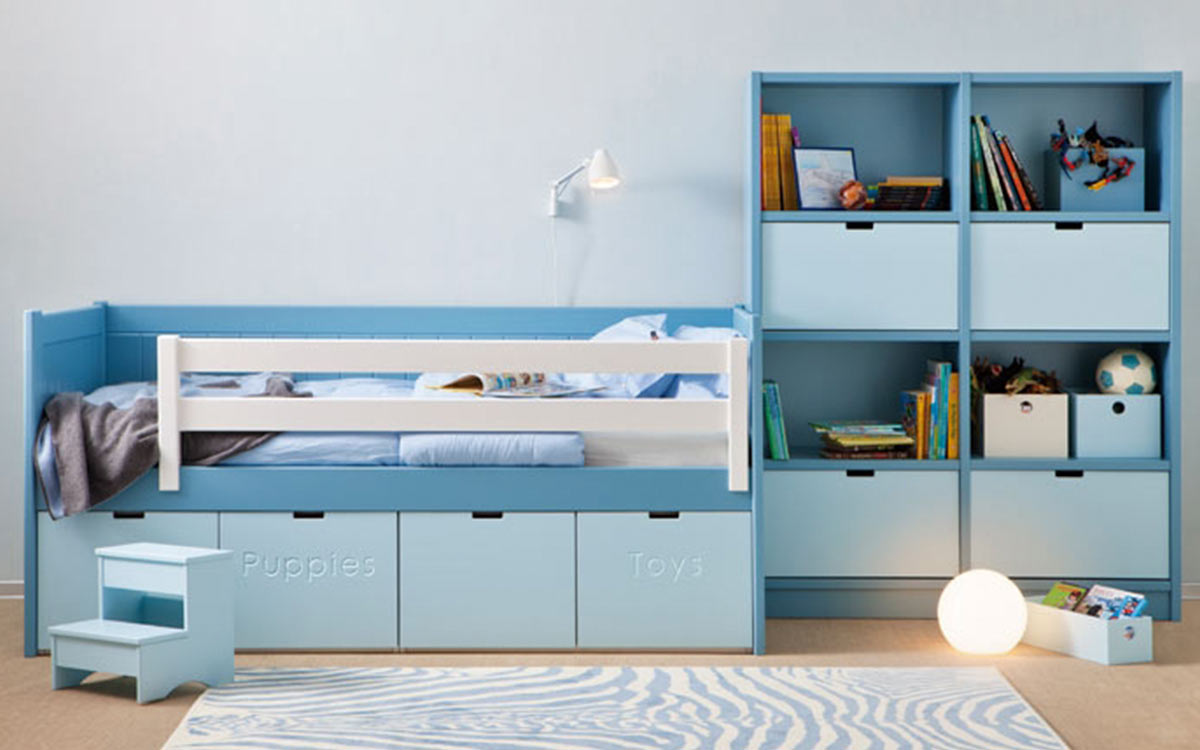 habitación infantil con cama nido juguetero y cajones de almacenamiento