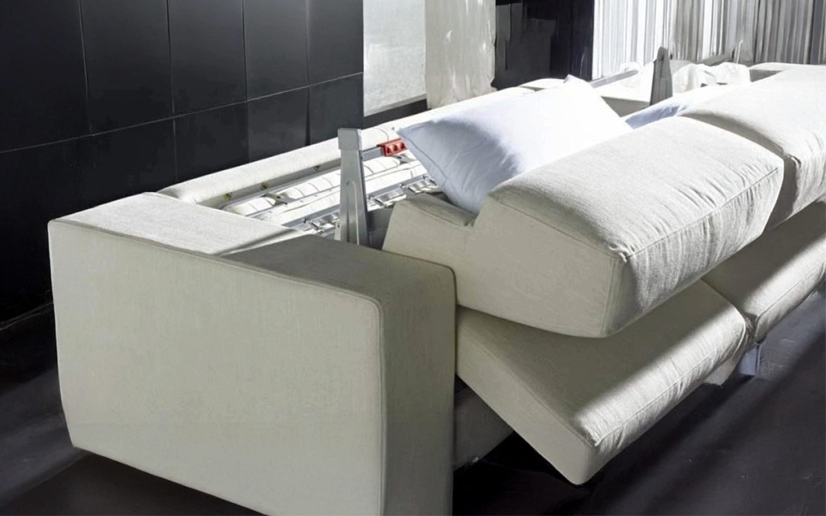 Gran sofá cama con chaise longue de brazo largo, cama de matrimonio cómoda, con almacenaje y estructura reforzada. Diseño abierto.