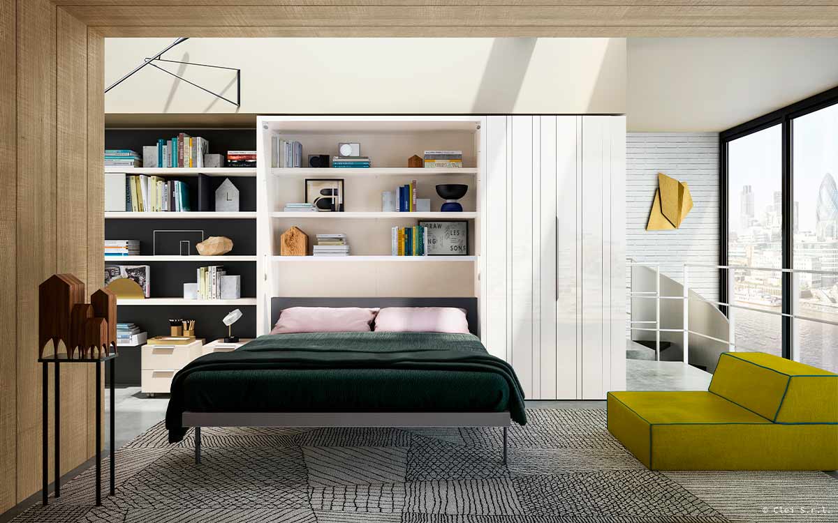 Mueble cama abatible de matrimonio con escritorio pivotante integrado y apertura segura.
