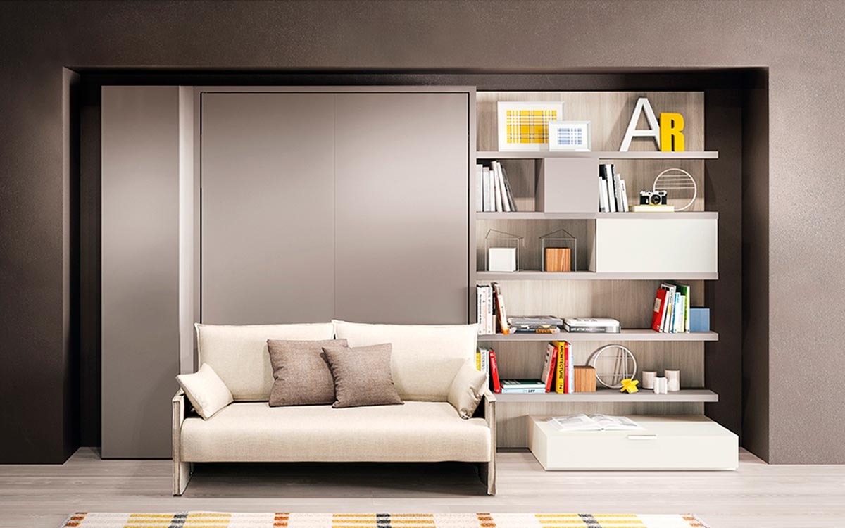 Mueble cama abatible autoportante con sofá frontal y comoda apertura vertical patentada.
